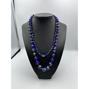 Woman’s Long blue glass swirl beads hand lnotted Necklace